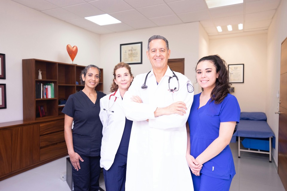 Diverse clinical team in a private-practice exam room